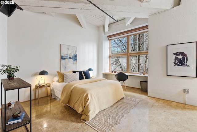 bedroom with vaulted ceiling with beams