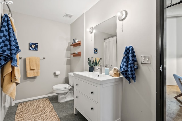 bathroom featuring baseboards, visible vents, vanity, and toilet