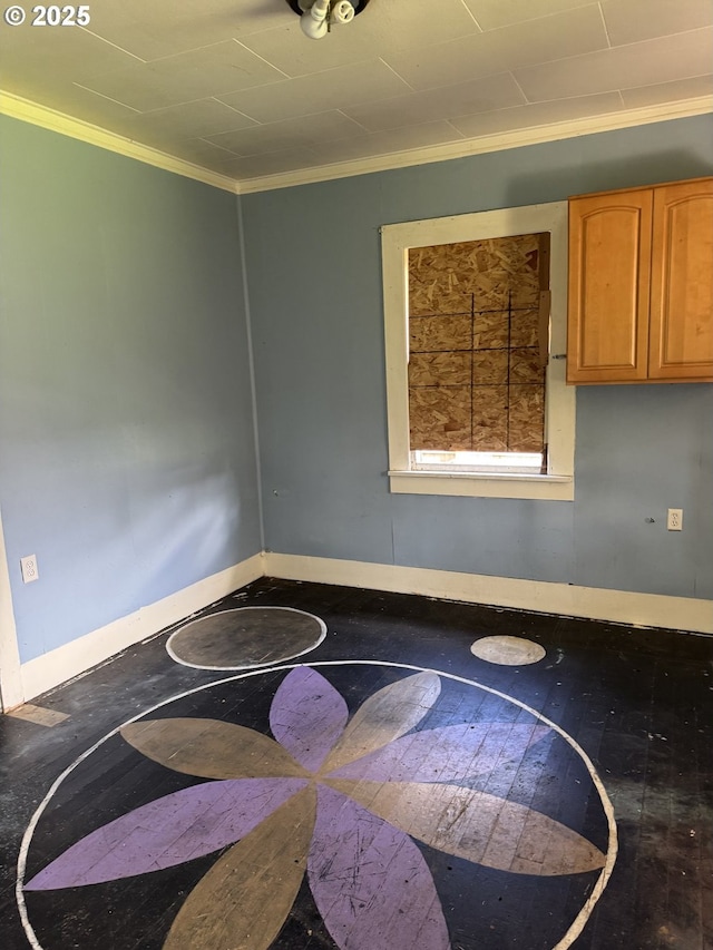 interior space with baseboards, hardwood / wood-style floors, and crown molding