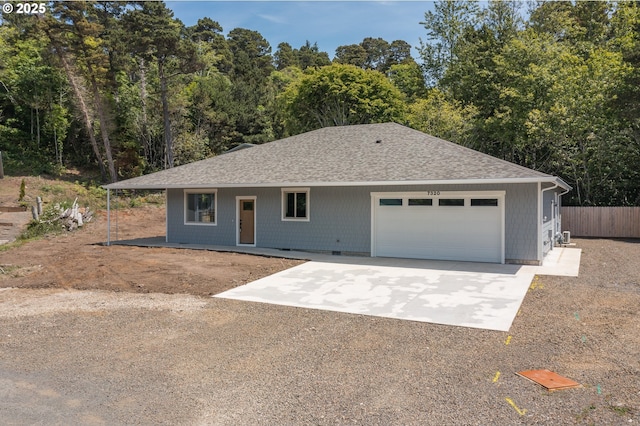 7320 Tanglewood Ave, Gleneden Beach, OR 97388 - ranch-style home featuring driveway, a garage, and roof with shingles