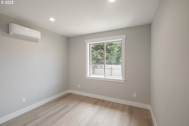 7320 Tanglewood Ave, Gleneden Beach, OR 97388 - spare room with a wall mounted air conditioner, light wood-style floors, and recessed lighting