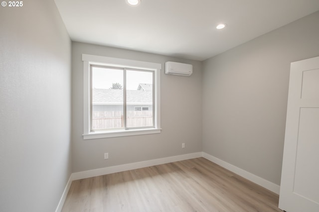 7320 Tanglewood Ave, Gleneden Beach, OR 97388 - spare room with an AC wall unit, light wood-style flooring, and recessed lighting