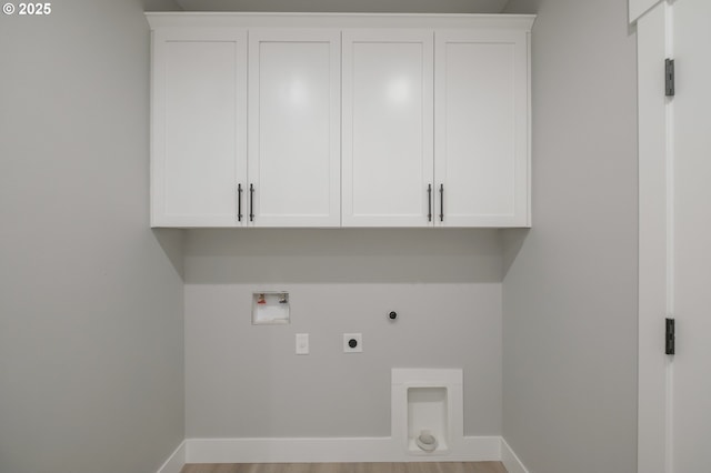 7320 Tanglewood Ave, Gleneden Beach, OR 97388 - laundry area featuring hookup for an electric dryer, cabinet space, hookup for a washing machine, gas dryer hookup, and wood finished floors