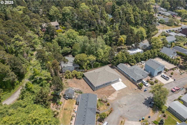 7320 Tanglewood Ave, Gleneden Beach, OR 97388 - aerial view of property's location with nearby suburban area and a heavily wooded area
