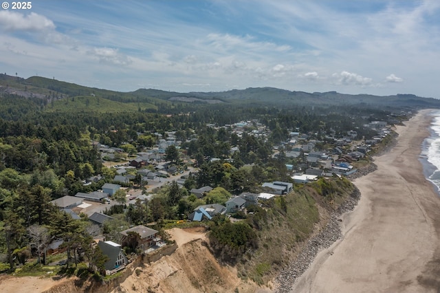 7320 Tanglewood Ave, Gleneden Beach, OR 97388 - aerial overview of property's location with nearby suburban area and a mountain backdrop