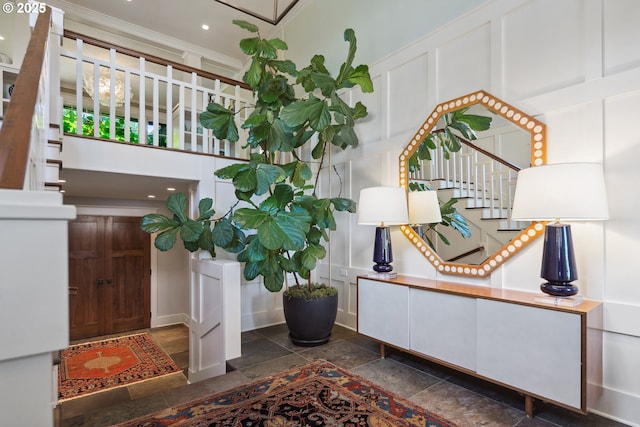 17900 Crestline Dr, Lake Oswego, OR 97034 - entrance foyer featuring a decorative wall, stairway, ornamental molding, a towering ceiling, and recessed lighting