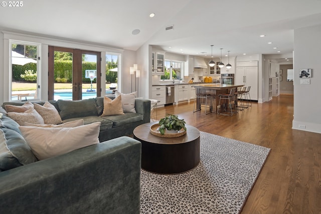 17900 Crestline Dr, Lake Oswego, OR 97034 - living room featuring dark wood-type flooring, lofted ceiling, and recessed lighting