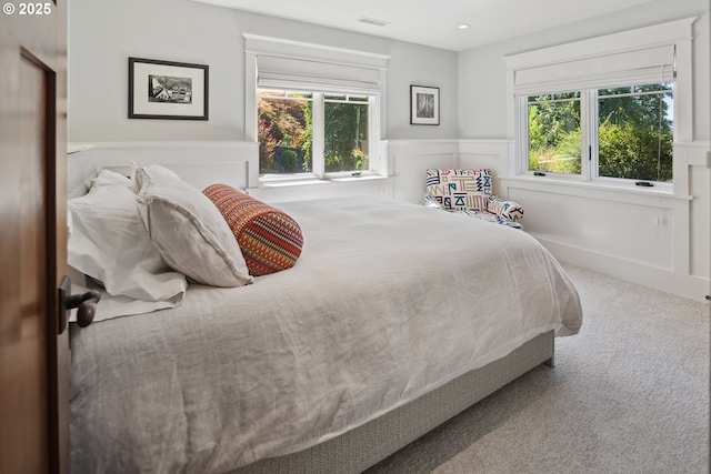 17900 Crestline Dr, Lake Oswego, OR 97034 - bedroom with multiple windows, carpet floors, a wainscoted wall, a decorative wall, and recessed lighting