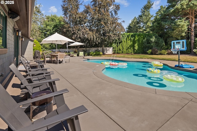 17900 Crestline Dr, Lake Oswego, OR 97034 - view of swimming pool with a patio and view of scattered trees