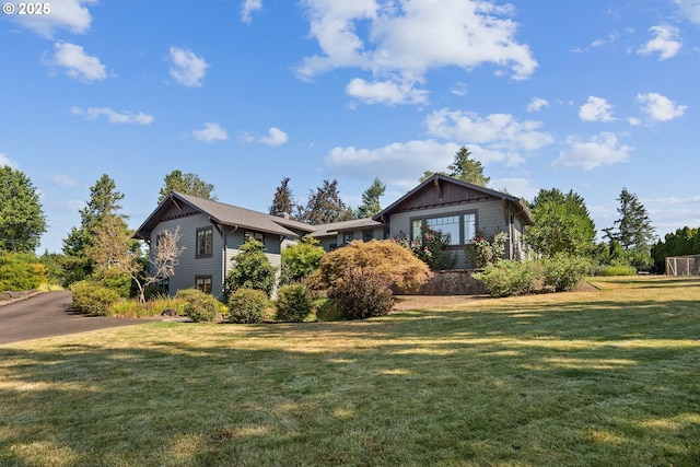 17900 Crestline Dr, Lake Oswego, OR 97034 - rear view of house featuring a lawn and board and batten siding