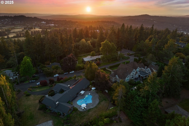 17900 Crestline Dr, Lake Oswego, OR 97034 - aerial view of property and surrounding area featuring a forest, a pool, and a mountainous background
