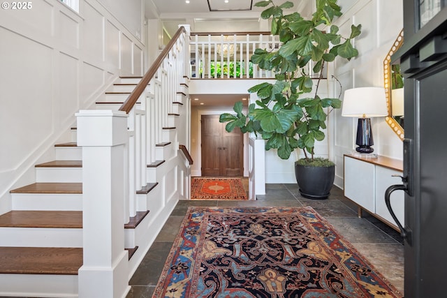 17900 Crestline Dr, Lake Oswego, OR 97034 - entrance foyer with stone tile flooring, stairs, and a towering ceiling