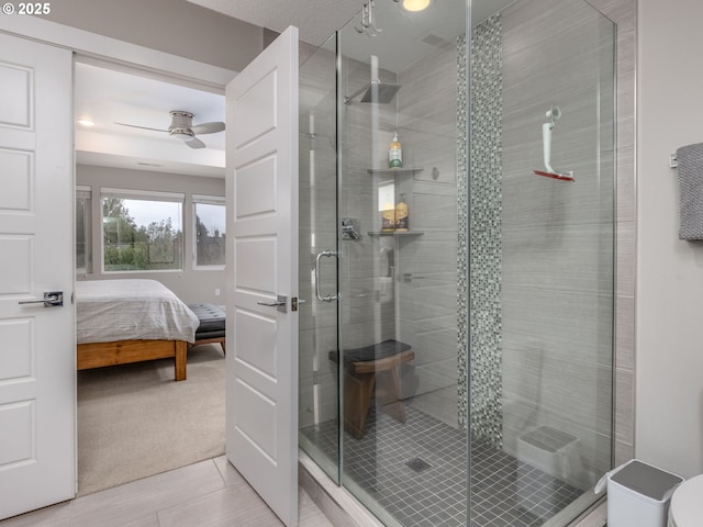 bathroom with ensuite bath, a shower stall, a ceiling fan, and tile patterned flooring