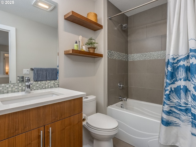 bathroom with vanity, backsplash, toilet, and shower / tub combo with curtain