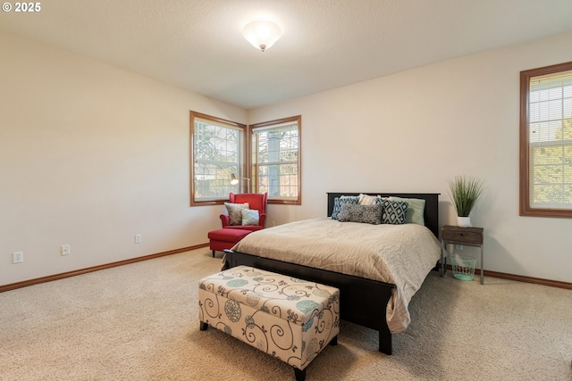 bedroom with carpet and baseboards