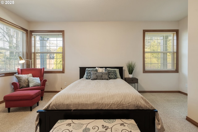 bedroom with carpet flooring and baseboards