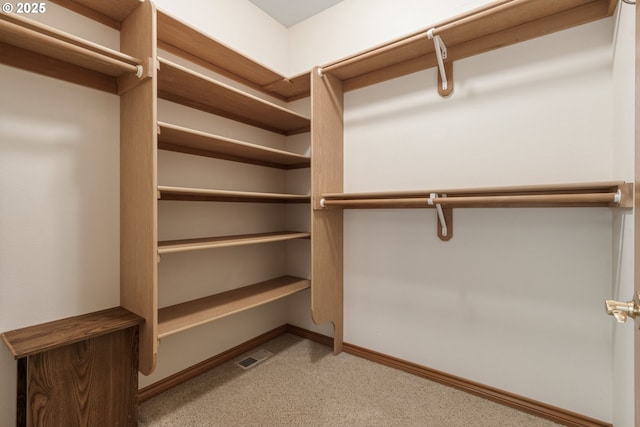 spacious closet featuring visible vents