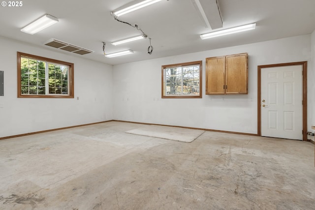 garage with visible vents and baseboards