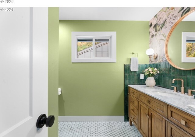 3707 SE Aldercrest Rd, Milwaukie, OR 97222 - bathroom featuring vanity, baseboards, and tasteful backsplash