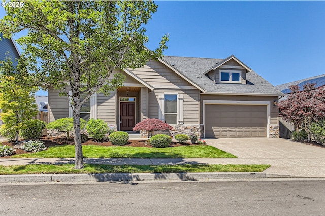 3881 SW Eleven Mile Ave, Gresham, OR 97080 - view of front facade with driveway, stone siding, a garage, and a shingled roof