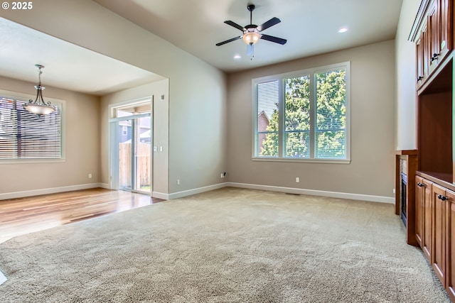 3881 SW Eleven Mile Ave, Gresham, OR 97080 - unfurnished living room featuring light carpet, ceiling fan, and recessed lighting