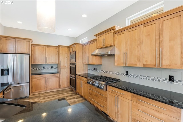 32092 SW Willamette Way E, Wilsonville, OR 97070 - kitchen with stainless steel appliances, under cabinet range hood, dark stone counters, backsplash, and recessed lighting