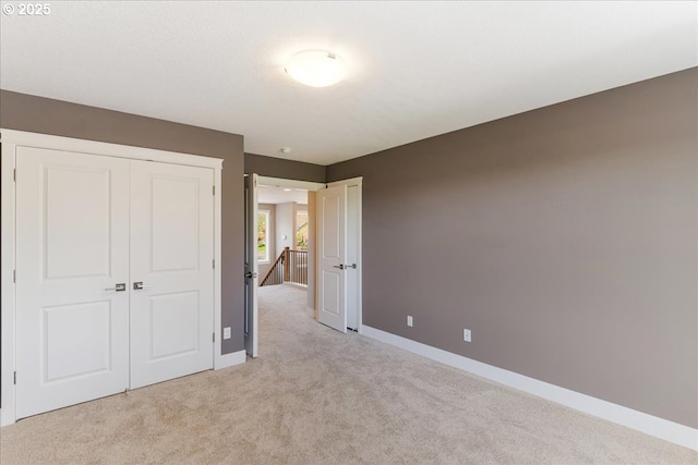 32092 SW Willamette Way E, Wilsonville, OR 97070 - unfurnished bedroom featuring light colored carpet, baseboards, and a closet