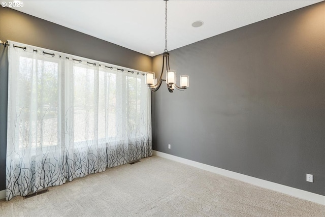 32092 SW Willamette Way E, Wilsonville, OR 97070 - unfurnished room featuring a chandelier, carpet flooring, and baseboards