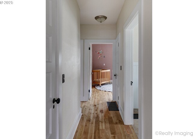 corridor featuring light hardwood / wood-style flooring