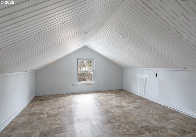 additional living space featuring vaulted ceiling