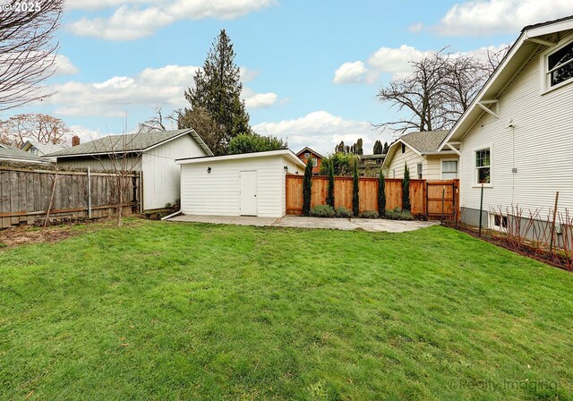 view of yard with a patio area and an outdoor structure