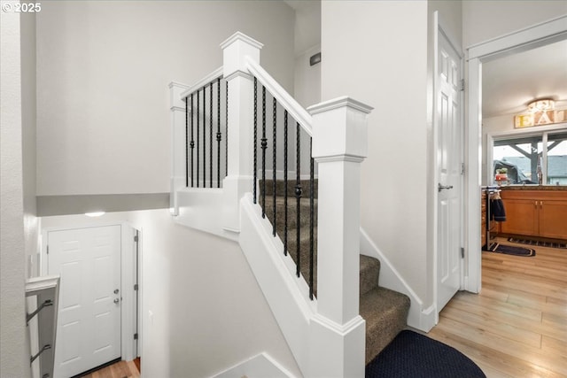 901 SE Olympia Dr, Vancouver, WA 98683 - stairway with a towering ceiling and wood finished floors