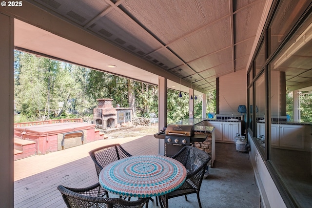 18347 S Winnifred Ave, Molalla, OR 97038 - view of patio featuring area for grilling, an outdoor stone fireplace, outdoor dining space, a covered hot tub, and a wooden deck