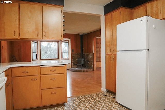 375 Fir Knoll Ln, Salem, OR 97317 - kitchen with a wood stove, white appliances, light countertops, and light floors