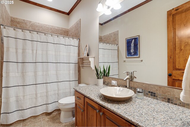 bathroom with crown molding, curtained shower, tile patterned floors, vanity, and toilet
