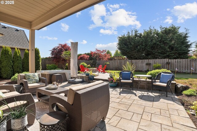 view of patio / terrace featuring an outdoor living space and a fenced backyard