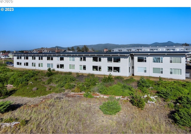 view of building exterior with a mountain view