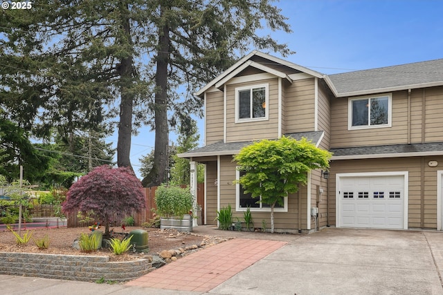 view of front facade with a garage, roof with shingles, concrete driveway, and fence