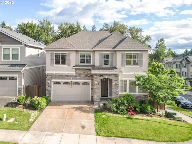 16944 SW Birdsong St, Beaverton, OR 97007 - view of front facade featuring stucco siding, stone siding, concrete driveway, and a garage