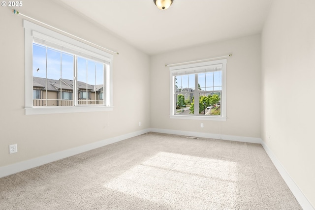 16944 SW Birdsong St, Beaverton, OR 97007 - carpeted empty room with plenty of natural light and baseboards