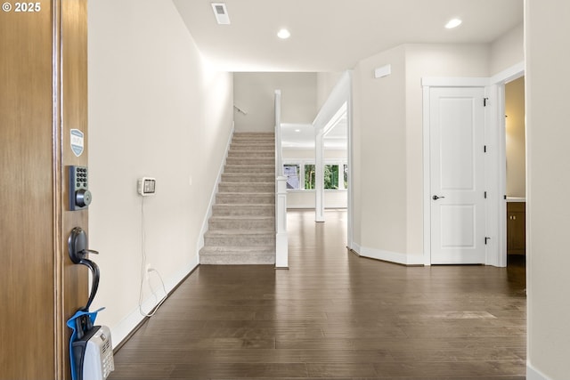 16944 SW Birdsong St, Beaverton, OR 97007 - entrance foyer featuring dark wood-style floors, baseboards, stairs, and recessed lighting