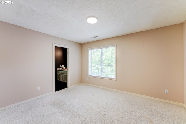 14488 Pfeifer Dr, Lake Oswego, OR 97035 - carpeted spare room featuring visible vents, a textured ceiling, and baseboards