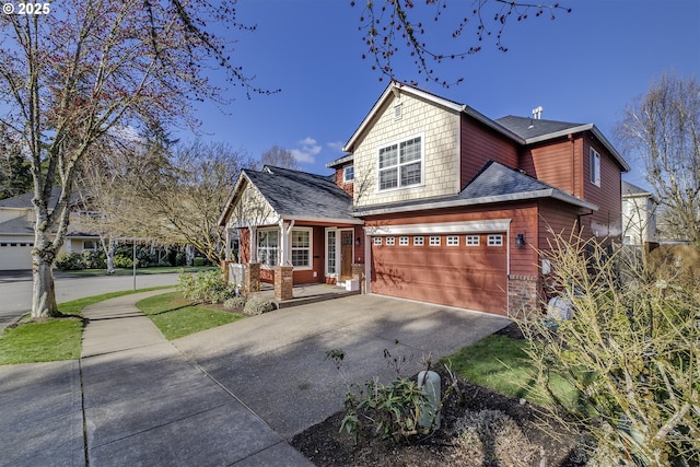 view of front of property featuring driveway, covered porch, an attached garage, and roof with shingles