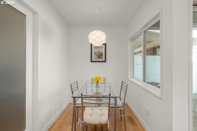 530 N Hayden Bay Dr, Portland, OR 97217 - dining area with wood finished floors, healthy amount of natural light, and baseboards