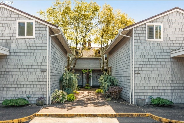 530 N Hayden Bay Dr, Portland, OR 97217 - view of exterior entry featuring a patio area and a chimney