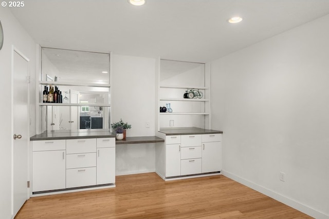 530 N Hayden Bay Dr, Portland, OR 97217 - kitchen featuring white cabinets, light wood-style floors, open shelves, dark countertops, and recessed lighting