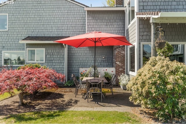 530 N Hayden Bay Dr, Portland, OR 97217 - exterior space featuring a patio area and a chimney
