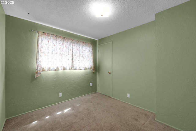 945 Irving Ct, Eugene, OR 97404 - spare room with a textured wall, a textured ceiling, and carpet