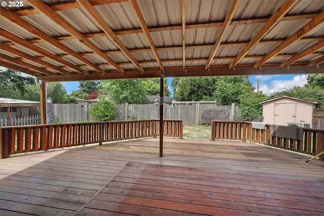 945 Irving Ct, Eugene, OR 97404 - wooden deck featuring a storage unit and a fenced backyard