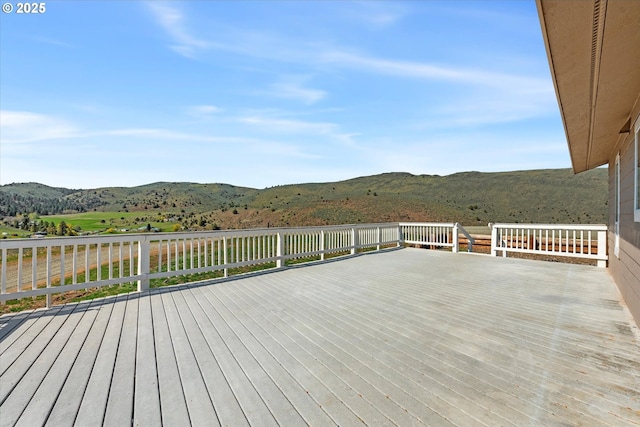 wooden deck featuring a mountain view